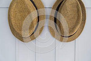 Two hats on wall background