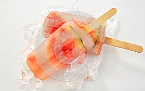 Two healthy frozen watermelon popsicles