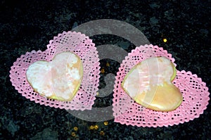 Two Heart Cookies on Two Doilies