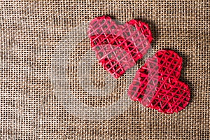 Two Hearts on burlap Background. Wedding Love Concept