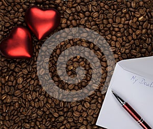 Two hearts on coffee with love letter