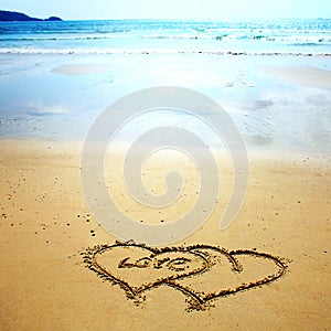 Two hearts drawn in the sand