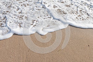 Wave on the sand beach