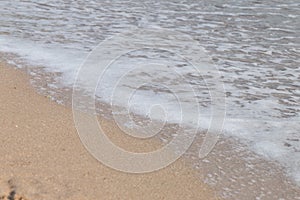 Wave on the sand beach