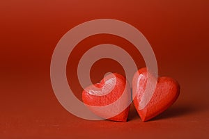 Two hearts on red background