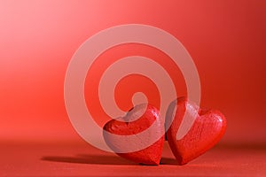 Two hearts on red background