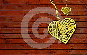 Two Hearts On Rustic Wooden table brown Background. 2 Heart Shape yellow with ropes in vintage wood, Love Concept