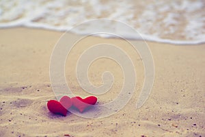 Two hearts on the summer beach