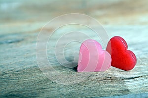 Two Hearts on Wooden Background