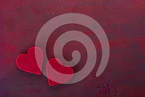 Two hearts on the wooden board painted in dark-red with copy space for text. Flat lay.  Valentine`s day background