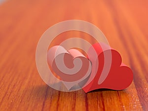 Two hearts on wooden floor 3d illustration