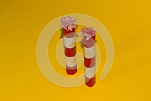 two heating plant chimneys with flowers instead of smoke, eco design minimal