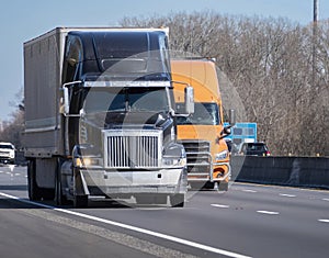 Two Heavy Trucks On Interstate
