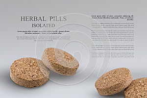 Two herbal pills from medicinal herbs,  isolated on grey background. Phytotherapy. Alternative supplement for good health.