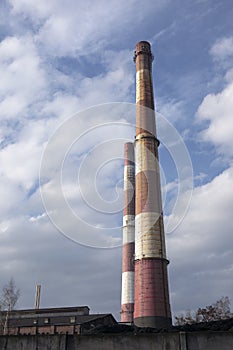 Two high industrial chimneys. Coal power plant by coal mine in Katowice, Silesia. Poland