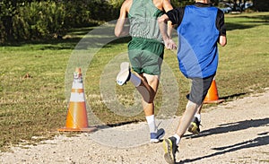 Two high school boys running a cross country race