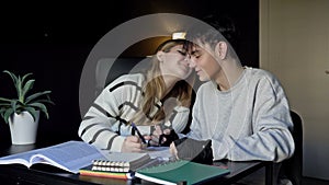 Two high school students, a boy and a girl, prepare for college lectures together. At the same time, teenagers listen to