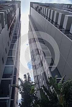 Two high towers against blue sky in a city