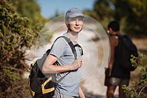 Two hikers men walk on trek in mountain. Trekking in mountains. Hills and mounts in sport tourism