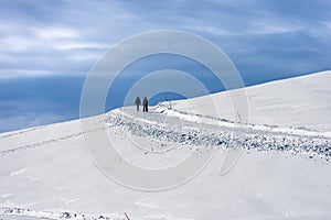 Two Hikers on a Snowy Footpath - Lessinia High Plateau Veneto Italy