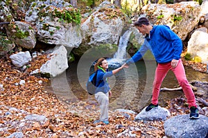 Two Hikers young Man and Smiling Woman holding hands