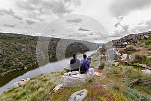 Two hiking friends enjoy the view in The Arribes del Duero Natural Park. Spain photo