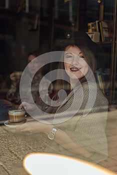 two hipster girls drinking coffee