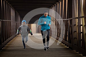 Two Hispanic Brothers Run A Race Down Bridge