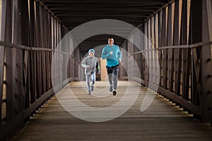 Two Hispanic Brothers Run A Race Down Bridge