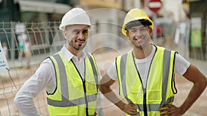 Two hispanic men architects smiling confident standing at street