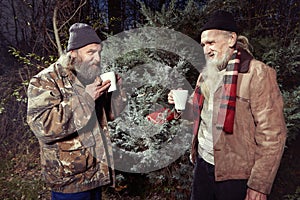 Two homeless men celebrating their christmas in park photo