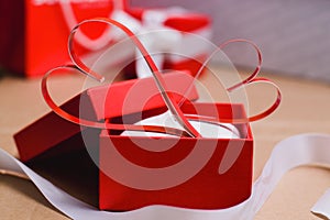 Two homemade paper red hearts in a red gift box, Symbol of Valentine`s Day