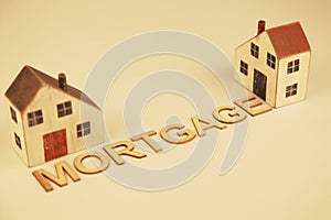 Two homes with the word mortgage