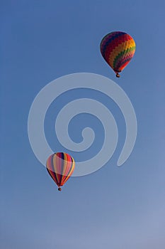 Two Hot Air Balloons against blue sky