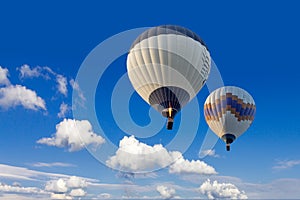 Two hot air balloons flying in sunsrise sky Cappadocia