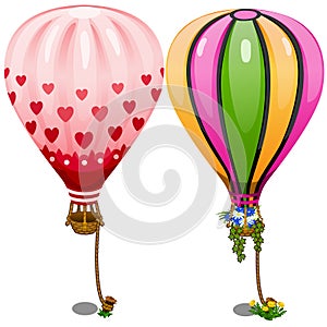 Two hot air balloons with hearts and flowers