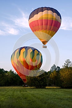 Two hot-air balloons taking off or landing