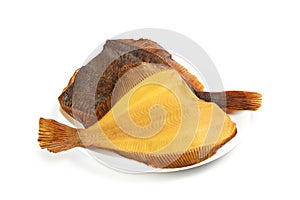 Two hot smoked flatfish on plate