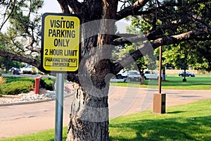 Two hour limit visitor parking sign