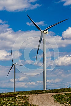 Two Huge High Tech Industrial Wind Turbines Generating Environmentally Sustainable Clean Electricity in Oklahoma.