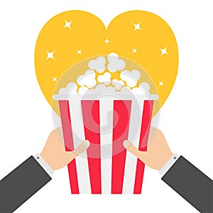 Two human businessman hands holding popcorn box. Heart shape. I love Movie Cinema icon in flat design style. Pop corn. Yellow
