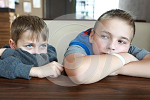 Two hungry children waiting food