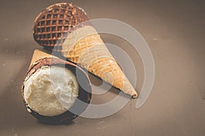 two Ice cream cone with chocolate/two Ice cream cone with chocolate on a dark background, selective focus