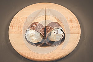 Two ice cream on a round wooden support/two ice cream on a round