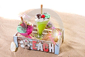 Two Icecreams in a box on the beach