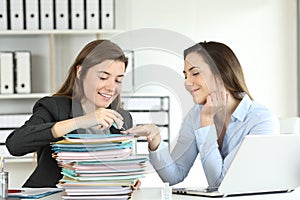 Two incompetent office workers wasting time photo