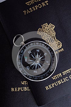 Two indian passports, a magnetic compass