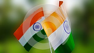 Two Indian tricolor national flags in nature background. Independence Day and Republic Day of India. 15 August Indian Tiranga