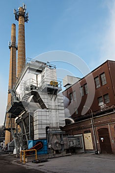 Two industrial chimneys with  brick