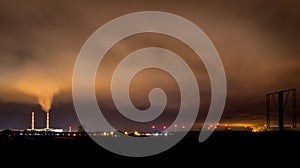 Two industrial chimneys spewing smoke into the sky